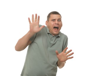 Mature man feeling fear on white background