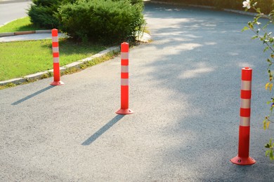 Traffic plastic poles on asphalt road outdoors