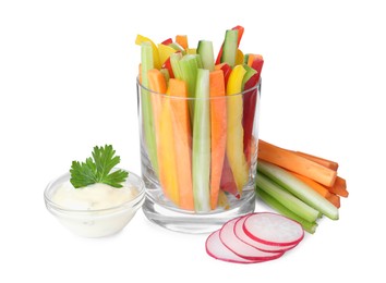 Photo of Different vegetables cut in sticks and bowl with dip sauce on white background