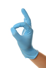 Person in blue latex gloves showing okay gesture against white background, closeup on hand