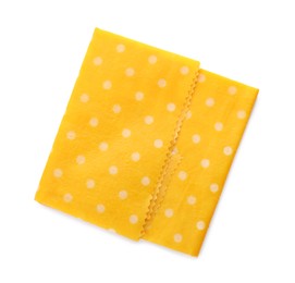 Yellow reusable beeswax food wrap on white background, top view