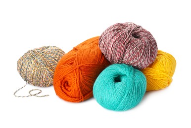 Different balls of woolen knitting yarns on white background