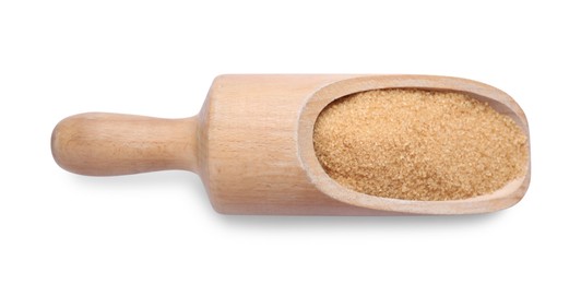 Wooden scoop with brown sugar isolated on white, top view