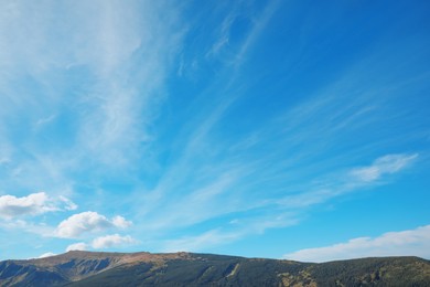 Picturesque view of sky with clouds over mountains