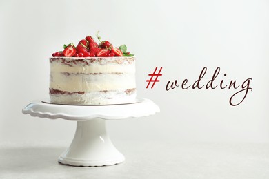 Delicious cake with fresh berries and hashtag Wedding on light background
