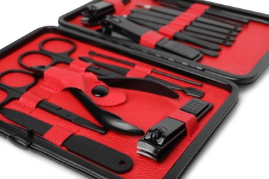 Photo of Manicure set in case on white background, closeup