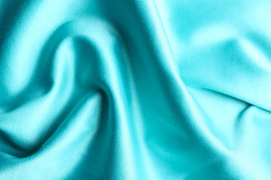 Texture of delicate light blue fabric as background, closeup
