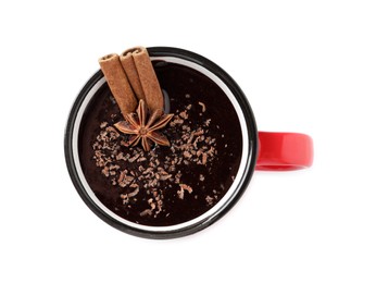 Yummy hot chocolate with cinnamon and anise in mug isolated on white, top view