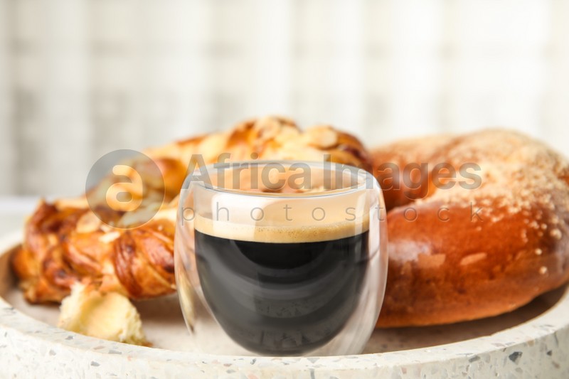 Photo of Fresh tasty pastries and coffee on tray, closeup
