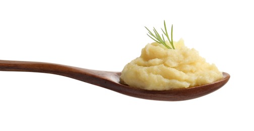 Wooden spoon of tasty mashed potatoes with dill isolated on white