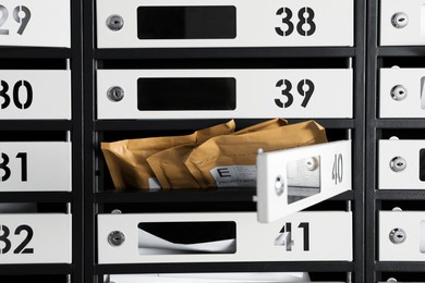 Open mailbox with keyhole, number and envelopes