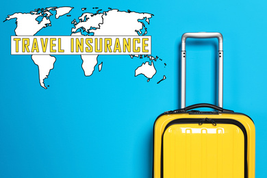 Yellow suitcase and phrase TRAVEL INSURANCE on blue background