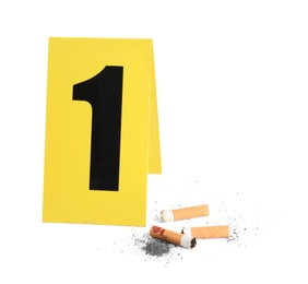 Cigarette stubs and crime scene marker with number one isolated on white
