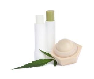 Different hemp cosmetics and green leaf on white background