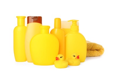 Set of baby cosmetic products, towel and rubber ducks on white background