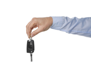 Man holding key on white background, closeup. Car buying