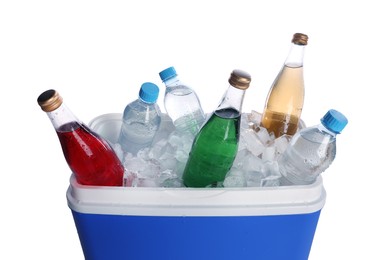 Blue plastic cool box with ice cubes and refreshing drinks on white background