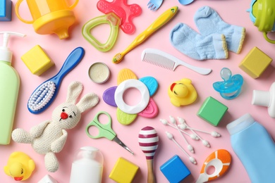 Flat lay composition with baby accessories on color background