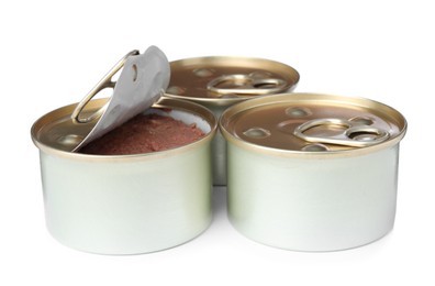Tin cans of wet pet food on white background