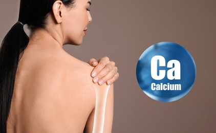 Role of calcium for human. Woman suffering from pain in shoulder on beige background, digital compositing with illustration of bone