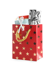 Shopping paper bag with presents isolated on white