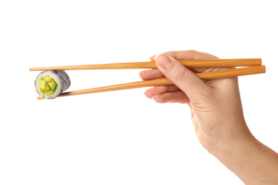 Woman holding sushi roll on white background, closeup