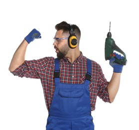 Young worker in uniform with power drill on white background
