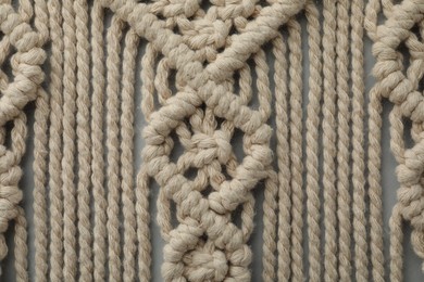 Photo of Texture of beautiful macrame as background, top view. Decorative element