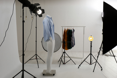 Ghost mannequin with modern clothes in professional photo studio