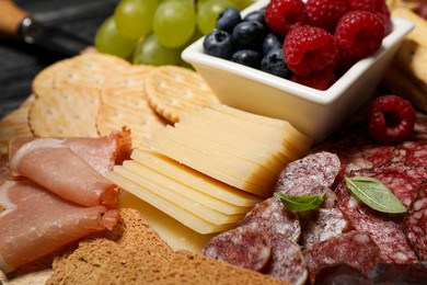 Snack set with delicious Parmesan cheese on table, closeup