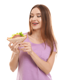Photo of Young woman with tasty sandwich on white background