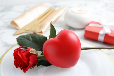 Beautiful table setting with decorative heart, closeup view. Valentine's day romantic dinner