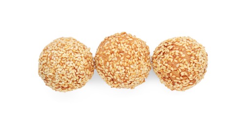 Photo of Delicious sesame balls on white background, top view