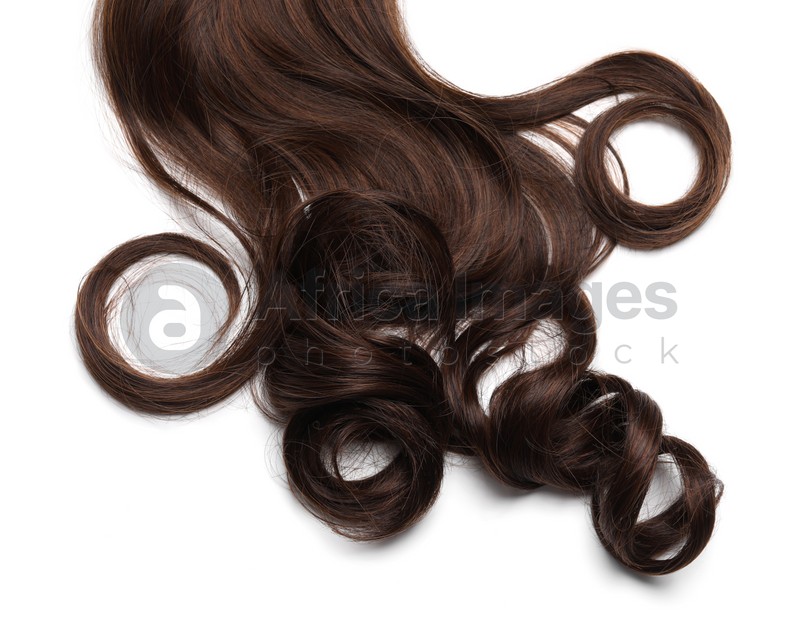 Beautiful dark brown curly hair isolated on white, top view