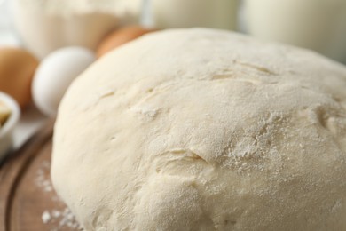 Photo of Raw dough for pastries on table, closeup