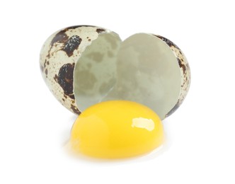 One cracked quail egg on white background