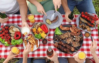 Group of friends with drinks at barbecue party outdoors, top view
