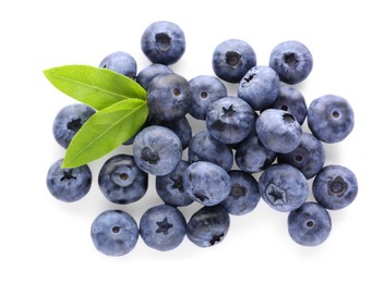 Pile of tasty fresh blueberries and green leaves on white background, top view