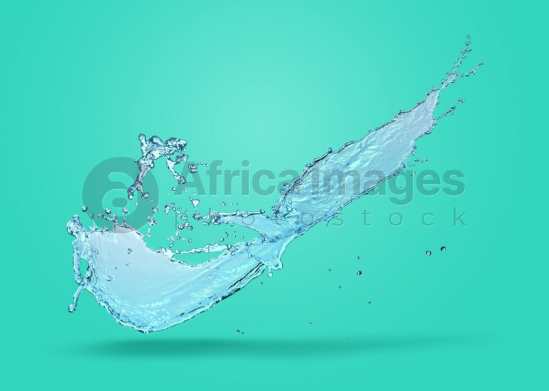 Splash of pure water on turquoise background
