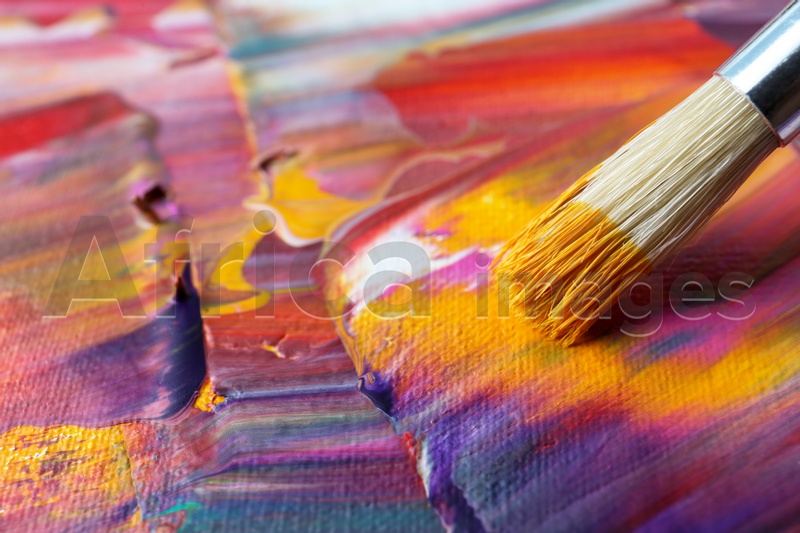 Abstract colorful paint and brush, closeup view