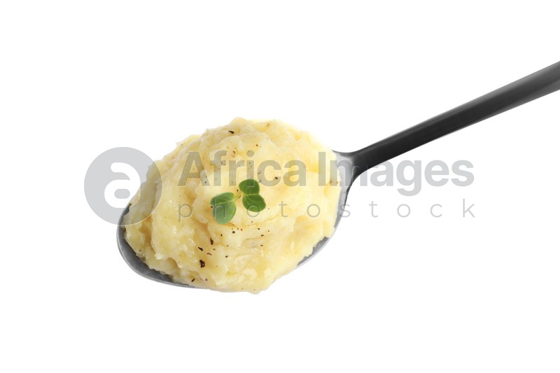 Photo of Spoon of tasty mashed potatoes with microgreen and black pepper isolated on white, top view