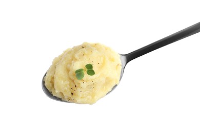 Spoon of tasty mashed potatoes with microgreen and black pepper isolated on white, top view