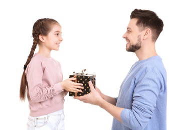 Man receiving gift for Father's Day from his daughter on white background