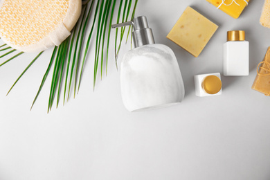 Flat lay composition with marble soap dispenser on white background. Space for text
