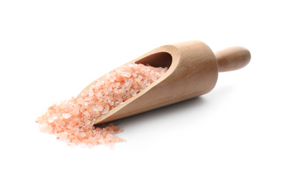 Wooden scoop with pink himalayan salt isolated on white