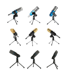 Set of different microphones on white background