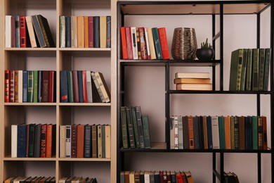 Collection of different books on shelves in home library