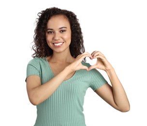 Photo of Happy young African-American woman making heart with hands on white background
