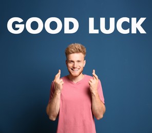 Image of Man with crossed fingers on blue background. Good luck superstition