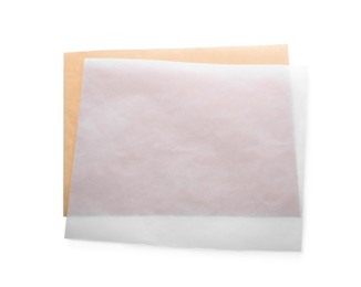 Photo of Sheets of baking paper on white background, top view